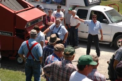 Selling a round baler at auction.